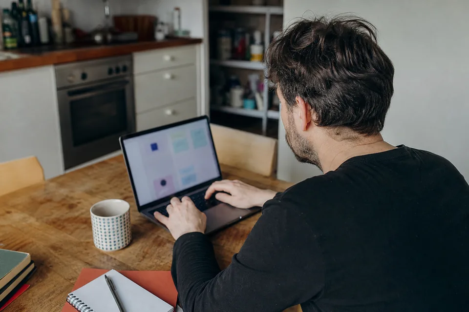 Creator setting up a membership page on a laptop